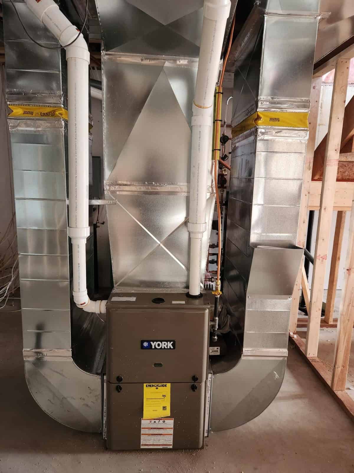 A furnace in a home under construction.